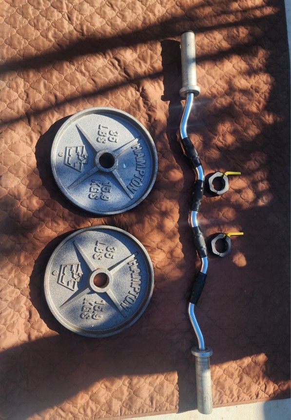 Olympic Weights With Curl Bar. 