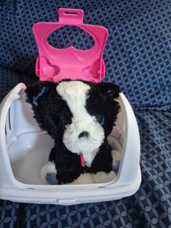 Stuffed dog in toy house
