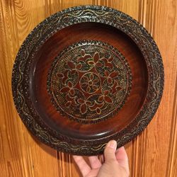 Wooden hand-carved decorative plate