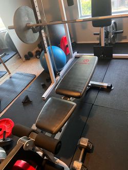 Smith machine, weights and dumbbell bar