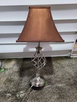 Silver and brown lamp