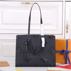 By Pool black Onthego Empreinte MM Leather Bag           34 x 12 x 26cm