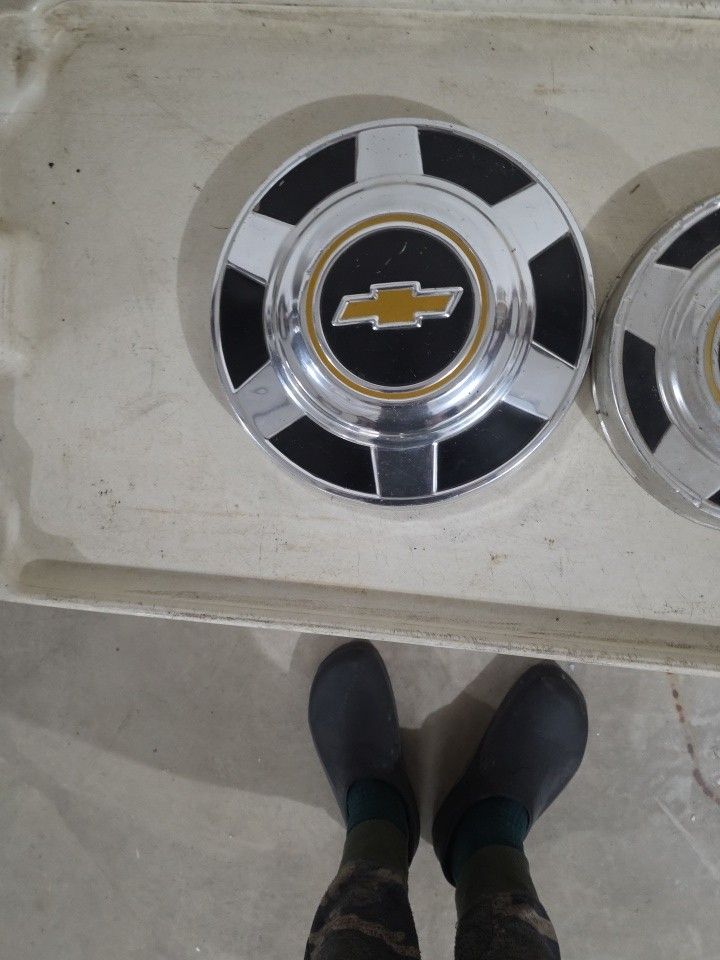 2 Different Size Chevy Hubcaps