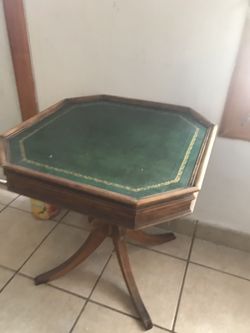 Antique pedestal accent table.