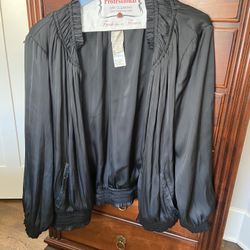 Chico's brand women's black jacket with a satin feel and dressy look.