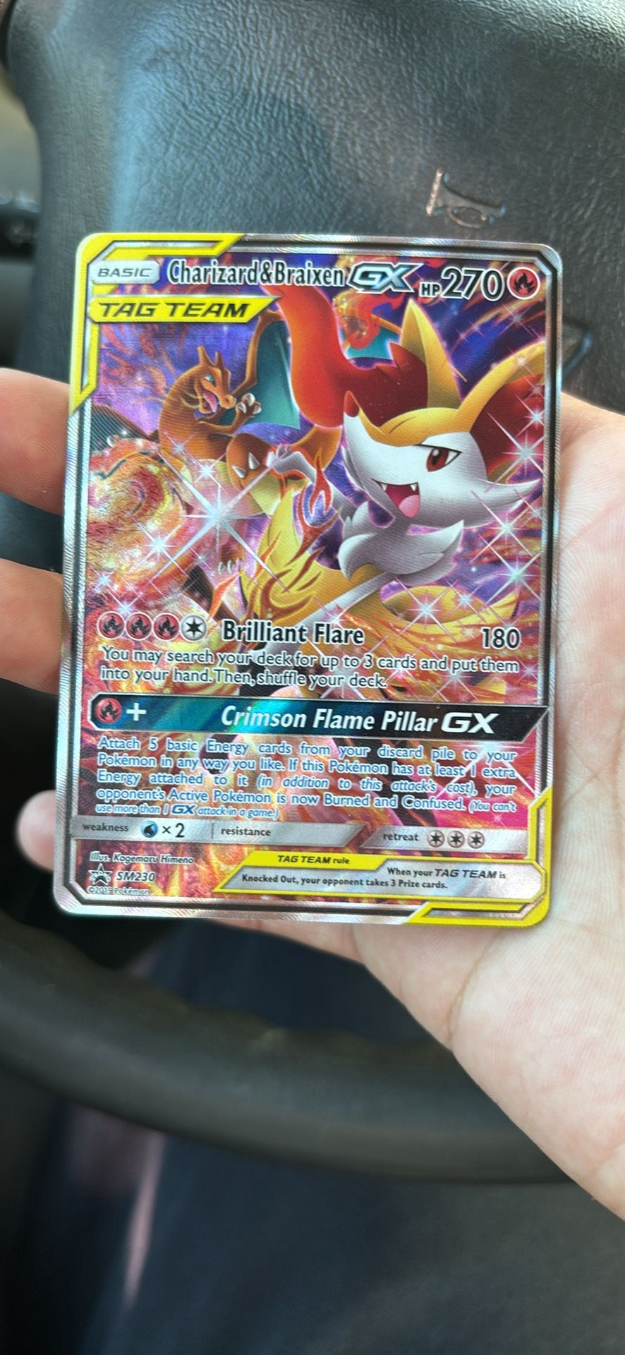 Charzard and braixen gx tag team