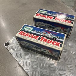 1994 Hess Rescue Truck- 2 collectible toy trucks released annually by Hess Corporation as part of a holiday tradition.. brand new in the original box