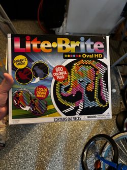 Complete Lite-Brite Oval HD set includes one oval screen, 650 colorful pegs, and 8 templates.