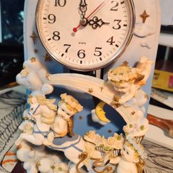 vintage Ch Collections or Katelyn Collection ceramic/resin angel quartz mantle clock
12 inches tall