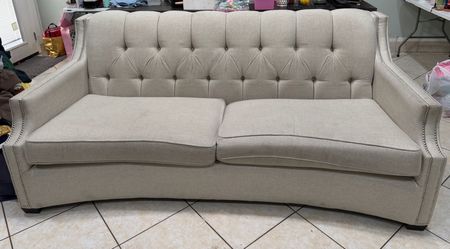 Beige Tufted Loveseat with Nailhead Trim