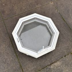 ~24” octagon window with crank to open and built in screen. Excellent used condition
