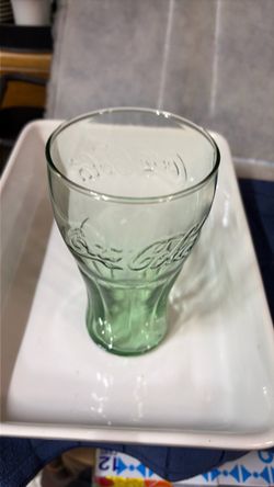Collectible green in color. Heavy n thick glass. 7 in. Tall