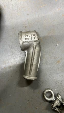 "Tiger Grip" tool is an electrical conduit fitting, specifically a specialized conduit connector likely used for holding or bending EMT (Electrical Me