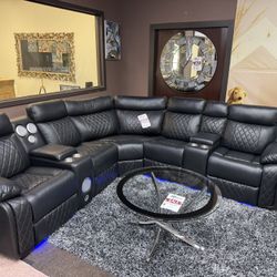 BLACK LEATHER ELECTRIC RECLINER SECTIONAL WITH SPEAKER SYSTEM 