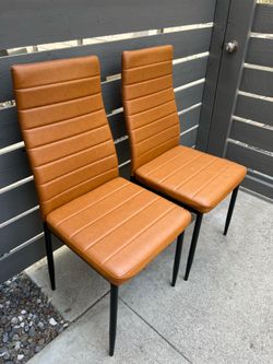2 modern dining chairs high backs