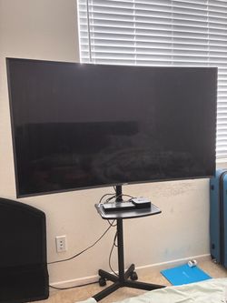 Samsung 55” Curved 4K Smart TV + Rolling Stand + Apple TV