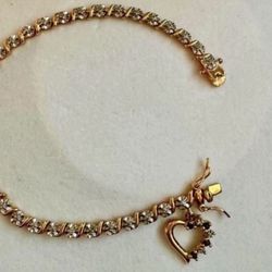 Vintage 925 sterling silver gold cubic zirconia tennis rhinestone bracelet with heart shaped charm  Approx 7.75” length  In great condition