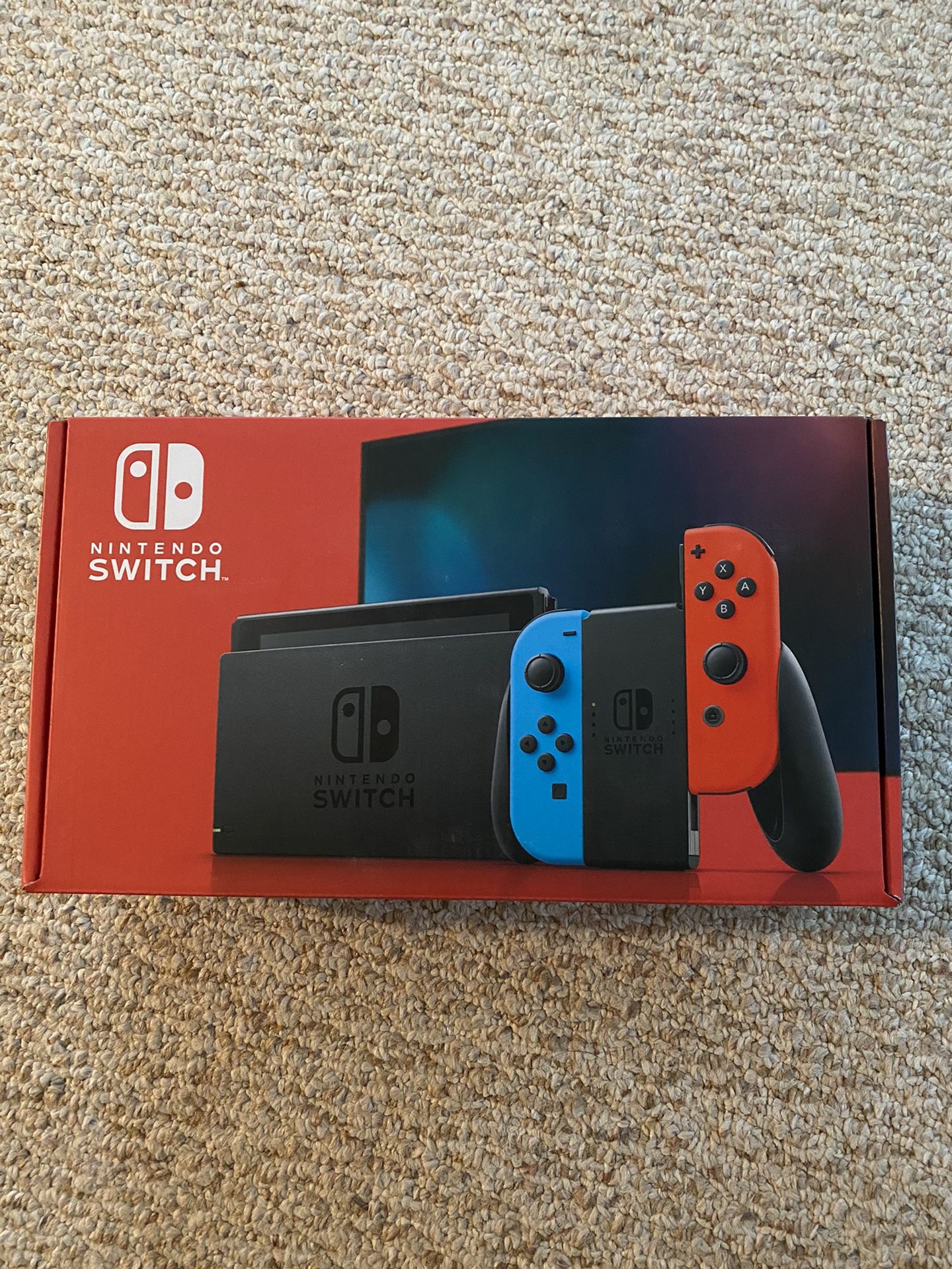 Brand New Nintendo Switch v2 console ... with red and blue controllers. Never opened