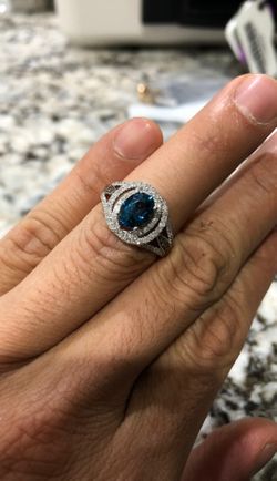 14kt White gold diamond and blue topaz ring