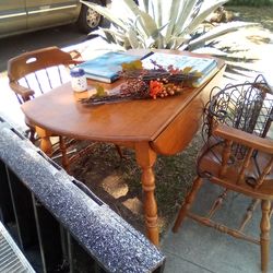 Solid maple wood winged dining table and two chair. Price is firm!