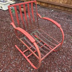 Antique metal rocking chair in great condition, no rust. Has been repainted red although the original color was green. Just add your favorite cushion 