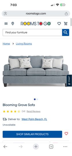 Blooming Grove Sofa with ottoman in excellent condition (from Rooms To Go)