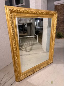 Large Ornate gold-framed wall mirror