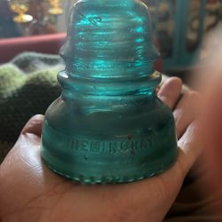 The item in the image is a Hemingray No. 40 glass insulator, likely produced between the late 1800s and early 1920s. These were commonly used in teleg
