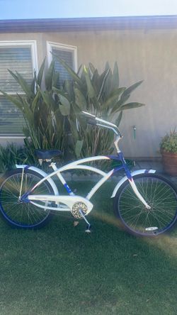 Phat Bicycles Beach cruiser with fenders, white body with blue contrast, with red pinstriping
