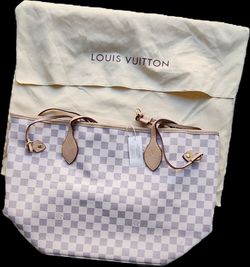 Brand new purse w/ attached coin/makeup bag. Comes with dust cover