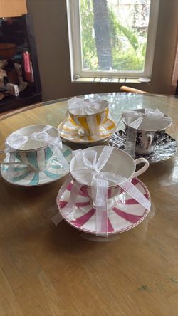TEA CUPS WITH MATCHING SAUCERS