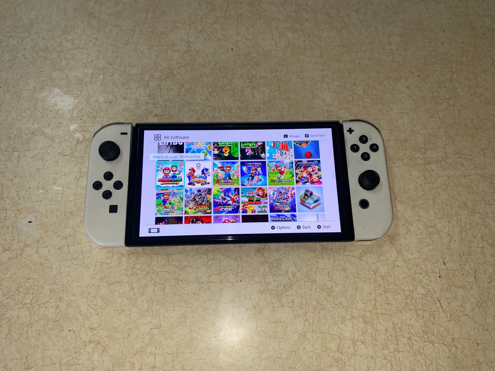 NINTENDO SWITCH OLED with 120 SWITCH GAMES and 7000 CLASSIC GAMES