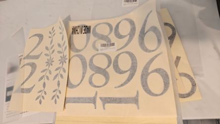 Die cut black vinyl house number decals