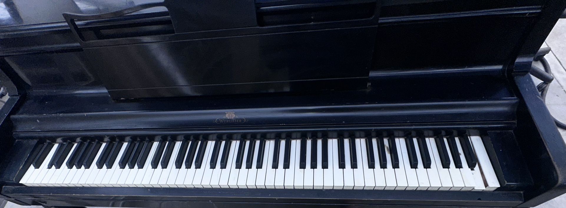 Black Wurlitzer Piano that needs love