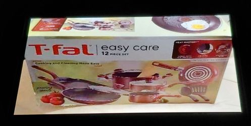 Brand new beautiful T-Fal 12 pieces cookware set in box.  ( never used ).
