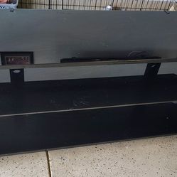 Sturdy black glass TV Stand 60Lx22Hx19.5W