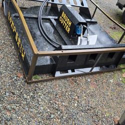 Brand new 72” skid steer brush cutter — certified life saver for yard work.