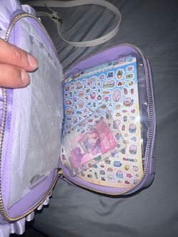 Decorated purple purse and shoulder bag. Both have cute designs