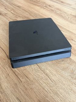 PlayStation 4 Slim 1TB Bundle – Includes Controllers + Wireless Headset