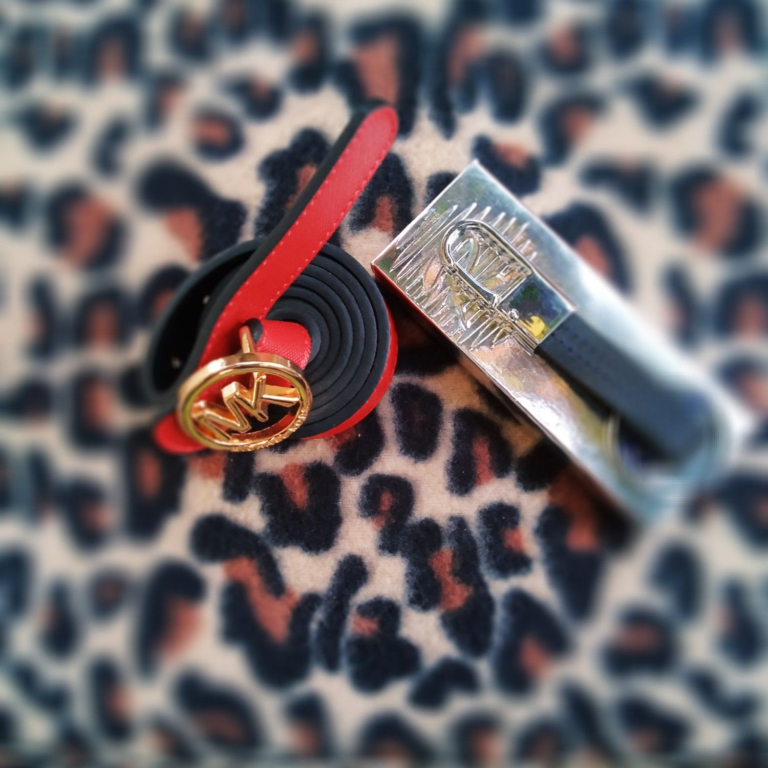 Women Mk belt and Rivera key ring.