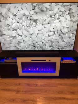 75” TV with TV Stand with Electric Fireplace Insert