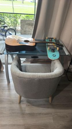 Mirrors, console tables, desk, guitar, skateboard, chairs, end tables, selling everything in a furnished department.