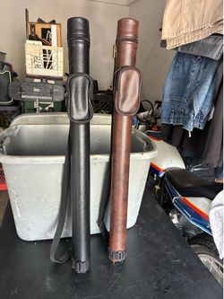 Pool cues w cases.