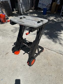 Black & Decker Workmate 375 portable folding workbench and vise, featuring an impact-resistant plastic top, built-in clamping cranks, an integrated wh