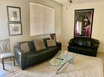 Leather sofa and loveseat.