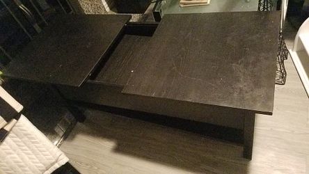 Black coffee table with compartment and expand