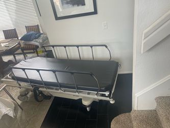 Stryker medical bed with adjustable  rail