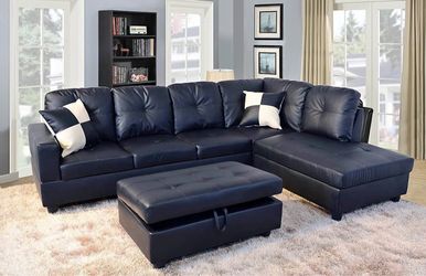 Black leather sectional couch and ottoman