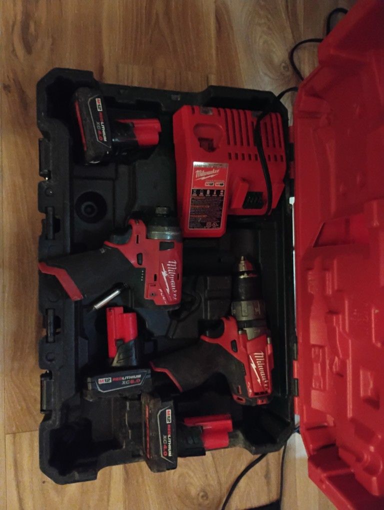Milwaukee Impact And Drill Set With 3 Batteries And Charger