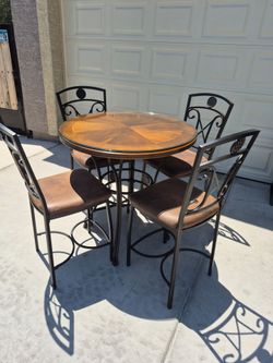 Wood and metal dining set,  high table with 4 chairs in very good condition